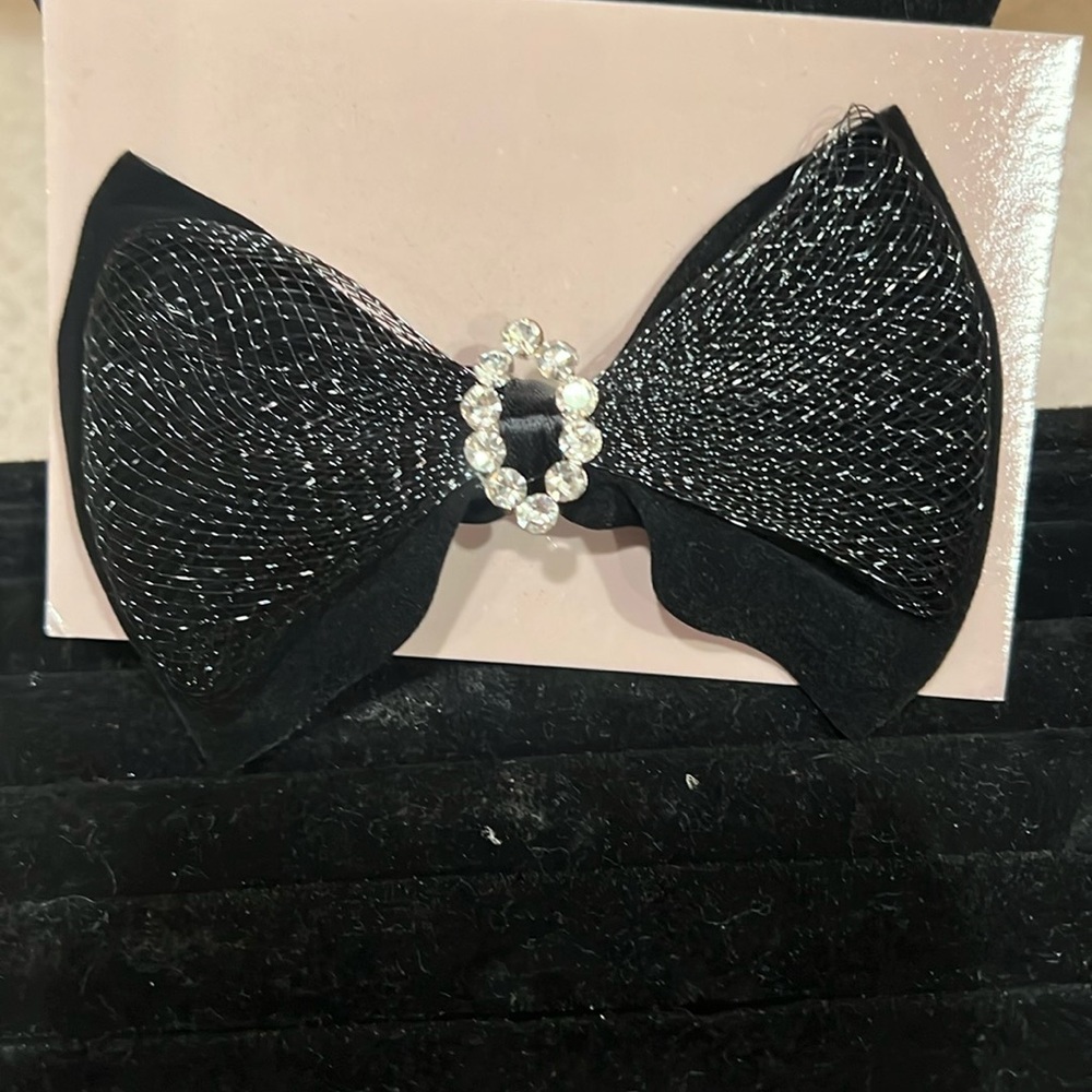 A black bow pin